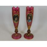 A pair of 19thC. Bohemian glass cranberry vases wi