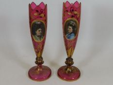 A pair of 19thC. Bohemian glass cranberry vases wi