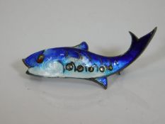 A silver enameled fish brooch with marcasite