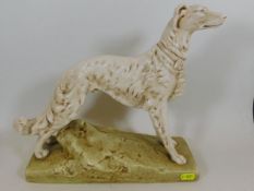 A large Czech porcelain figure of running dog appr