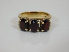 A 9ct gold ring set with garnets
