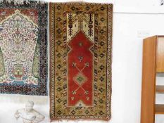 A Persian Koliai style carpet 57in x 30.5in