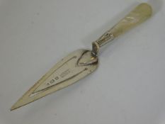 A hallmarked silver bookmark with mother of pearl