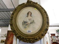 A gilt framed oval watercolour depicting lady sign