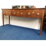 An 18thC. oak dresser base with brass fittings