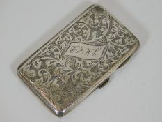 An inscribed cigarette case with chased decor