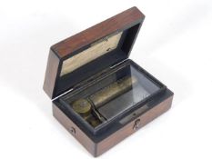 A compact 19thC. rosewood music box