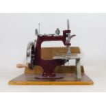 A boxed miniature sewing machine