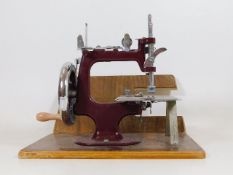 A boxed miniature sewing machine