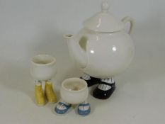 A Carlton Ware footed tea pot with two similar egg