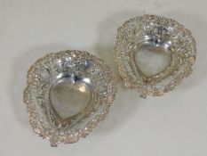 A pair of reticulated silver bon bon dishes