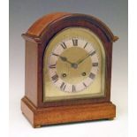 German mahogany arch cased mantel clock, the brass dial with silvered chapter ring having Roman
