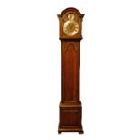 1930's period carved oak longcase clock, the hood with moulded arch shaped pediment, glazed door,