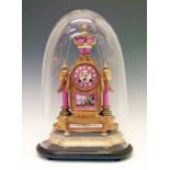 19th Century French gilt metal cased mantel clock, surmounted with a Sevres style pink and white