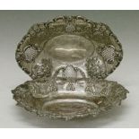 George V pierced and embossed silver oval bowl, London 1925 together with a some-what similar silver