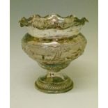 Indian embossed white metal bowl decorated with animals and figures in a landscape and standing on a