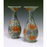Pair of late 19th/early 20th Century Japanese porcelain baluster shaped vases, each having tight-
