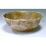 Late 19th Century Japanese Satsuma bowl having typical heavily gilded decoration depicting wisemen