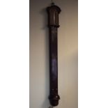 Antique mahogany stick barometer having an engraved brass dial, the reservoir with wrythened carving