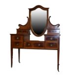 Late 19th/early 20th Century mahogany and satinwood crossbanded drop centre dressing table having