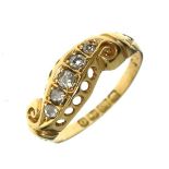 18ct gold dress ring set five graduated diamonds within a S scroll design, size M Condition: