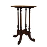 Late 19th Century mahogany circular top occasional table raised on four fluted supports above four