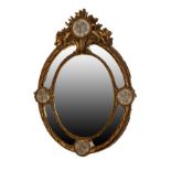 Reproduction oval gilt framed wall mirror with four relief cast roundels depicting putti Condition: