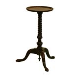 George III mahogany kettle stand having a circular dish top and standing on a turned and spiral