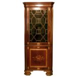 Sheraton style inlaid mahogany two section standing corner cabinet, having an upper section fitted