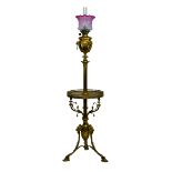 Late 19th/early 20th Century gilt brass floor standing oil lamp, now converted to electricity, the