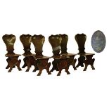 Set of six Georgian style walnut hall chairs, each having a shaped spoon back bearing the painted