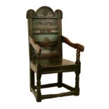 Antique oak Wainscot chair having an arch shaped crest rail, carved panel below with date 1559,