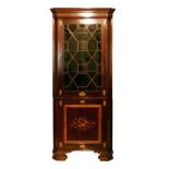 Sheraton style inlaid mahogany two section standing corner cabinet, having an upper section fitted