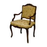 19th Century French carved beech fauteuil, having a carved crest rail, the open arms with conforming