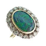 Black opal and diamond cluster ring, stamped '18ct', the oval shallow cabochon approximately 15.