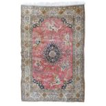 Good quality modern Persian silk rug, the central field decorated with a hunting scene on a pink