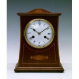 Early 20th Century inlaid mahogany mantel clock having a rectangular shallow domed top, white enamel