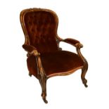 Victorian gentleman's carved oak framed balloon back open arm drawing room chair upholstered in deep