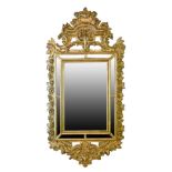 Antique Italian giltwood and gesso wall mirror, the plate with eight conforming surrounding mirrored