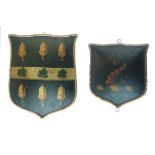 Two early 19th Century polychrome painted armorial plaques, the first bearing the arms of the