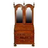 18th Century crossbanded figured walnut two section bureau bookcase, the double arch shaped top