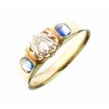 Diamond and sapphire three stone ring, unmarked, the central old brilliant cut of a tinted light