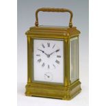 Large French brass cased carriage clock, white enamel dial with Roman numerals and subsidiary