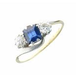 Sapphire and diamond three stone ring, stamped '18ct Plat', the square cut flanked by two