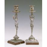 Pair of 19th Century electro plate candlesticks, each having a caryatid column, square foot and