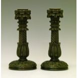 Pair of 19th Century Irish carved bog oak candlesticks, each sconce with inverted shamrock,