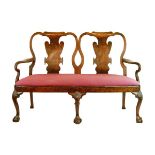 Queen Anne style two seater settee having a double splat back, scroll open arms, upholstered seat