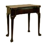 George III mahogany shaped top fold over card table, opening to reveal a baize top with wells, one