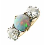 Black opal and diamond three stone ring, stamped '18ct', the circular cabochon 8.2mm diameter x