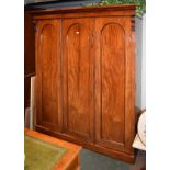 Victorian mahogany triple wardrobe fitted hanging space, brushing slides and drawers behind three